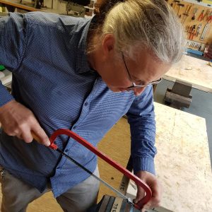 CAPOS 1. Cutting a piece of brass